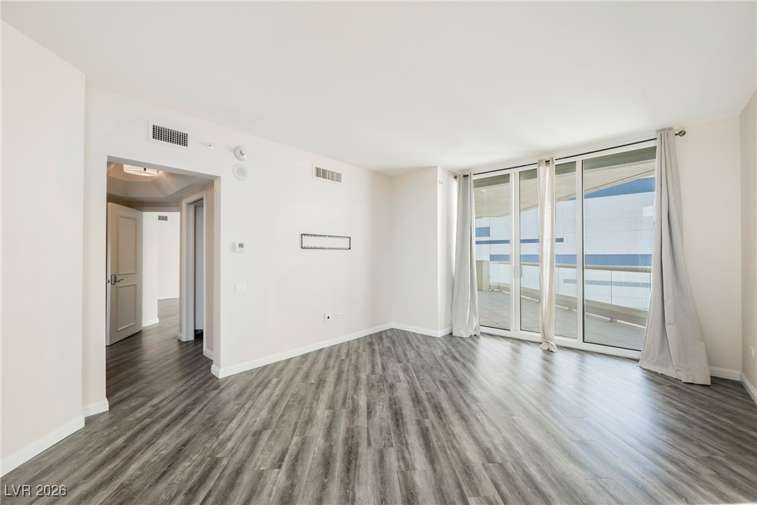 2877 Paradise Road, Unit 1604 Las Vegas, NV 89109 - Photo 18 of 47 Unfurnished room with wood finished floors and baseboards
