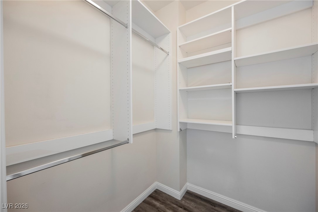 2877 Paradise Road, Unit 1604 Las Vegas, NV 89109 - Photo 24 of 47 Walk in closet featuring dark wood-type flooring