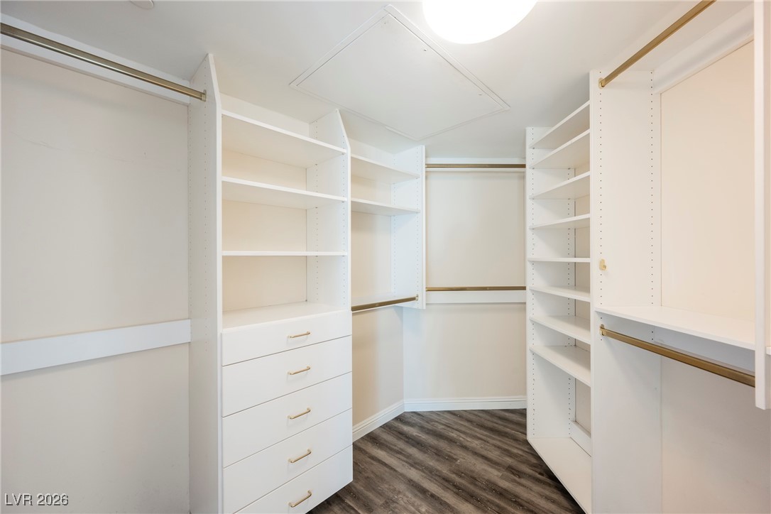 2877 Paradise Road, Unit 1604 Las Vegas, NV 89109 - Photo 25 of 47 Walk in closet with dark wood-style floors