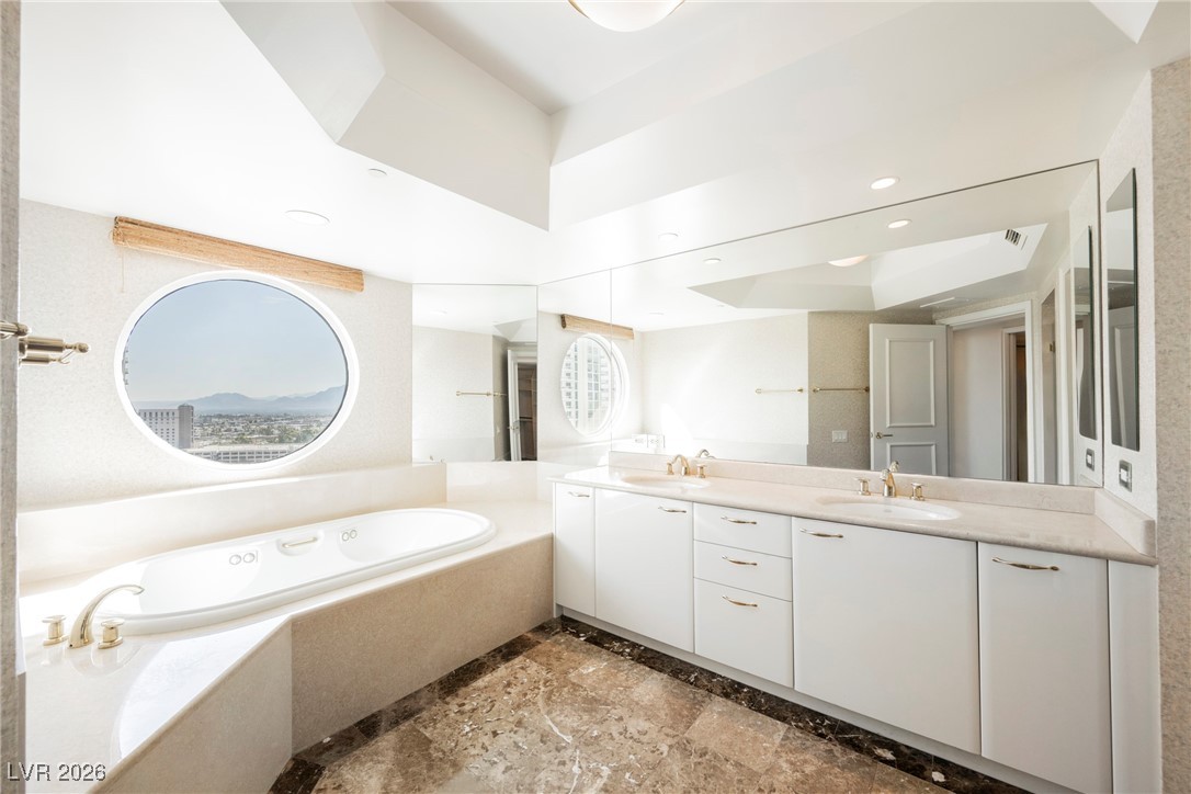 2877 Paradise Road, Unit 1604 Las Vegas, NV 89109 - Photo 26 of 47 Bathroom with a bath, double vanity, and marble finish floors