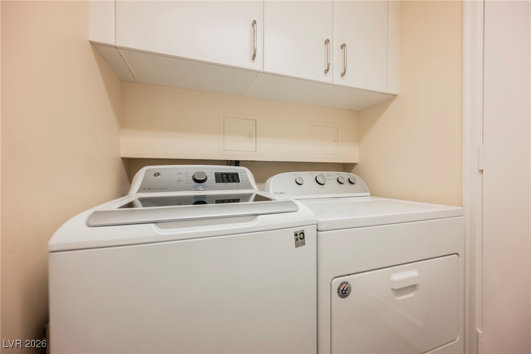 2877 Paradise Road, Unit 1604 Las Vegas, NV 89109 - Photo 35 of 47 Laundry room featuring independent washer and dryer and cabinet space