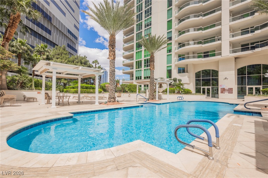 2877 Paradise Road, Unit 1604 Las Vegas, NV 89109 - Photo 41 of 47 Community pool featuring a patio and a pergola