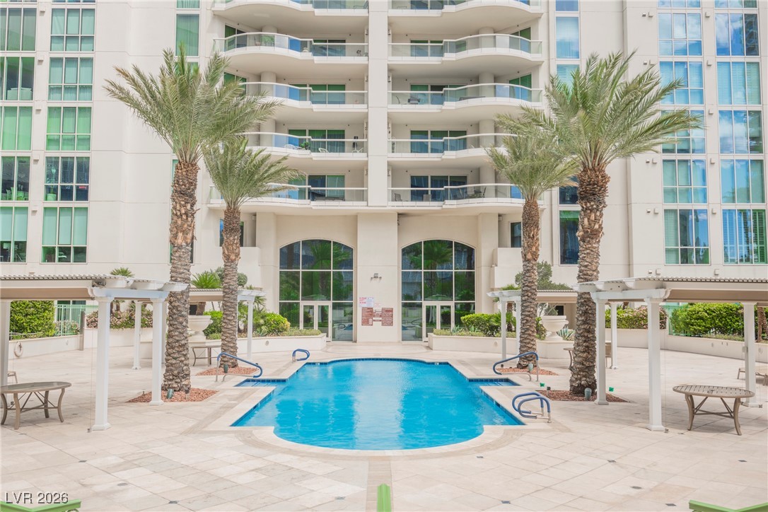2877 Paradise Road, Unit 1604 Las Vegas, NV 89109 - Photo 42 of 47 Community pool with a pergola and a patio area