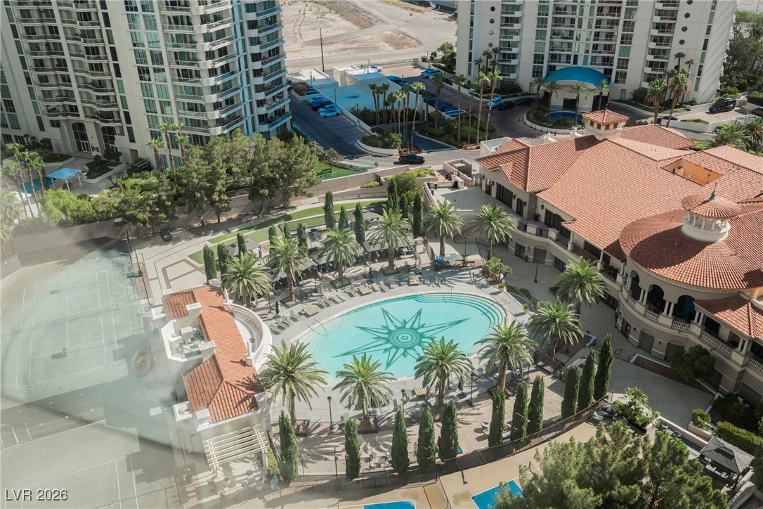 2877 Paradise Road, Unit 1604 Las Vegas, NV 89109 - Photo 46 of 47 Unfurnished room featuring dark wood-type flooring, floor to ceiling windows, and a mountain view