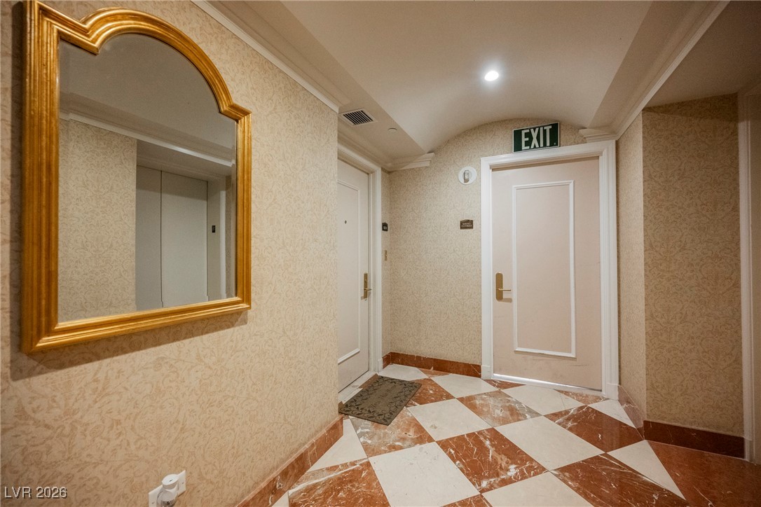 2877 Paradise Road, Unit 1604 Las Vegas, NV 89109 - Photo 7 of 47 Hall featuring lofted ceiling and baseboards