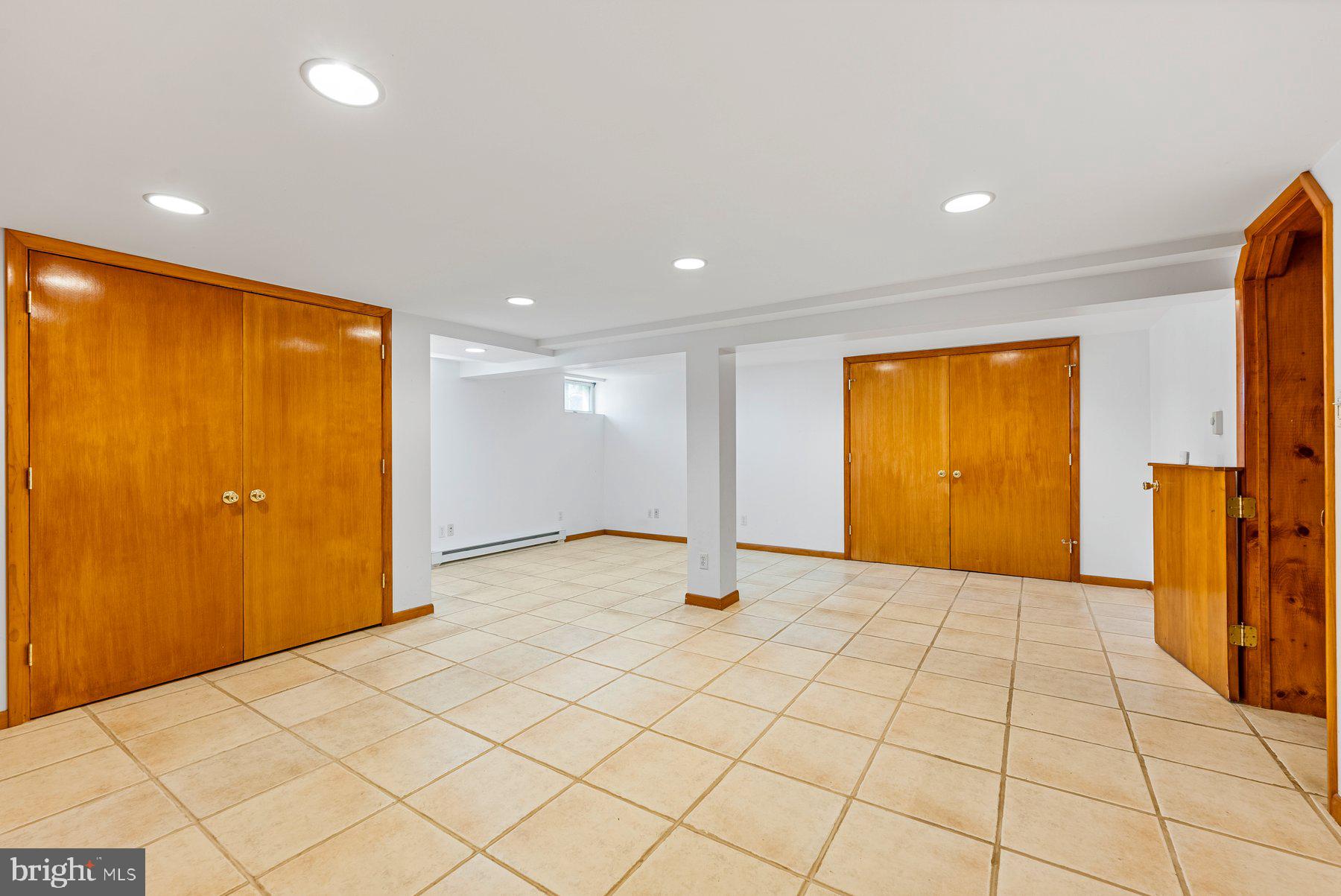 104 Hillside Road Baltimore, MD 21228 - Photo 17 of 34 a view of an empty room with a window