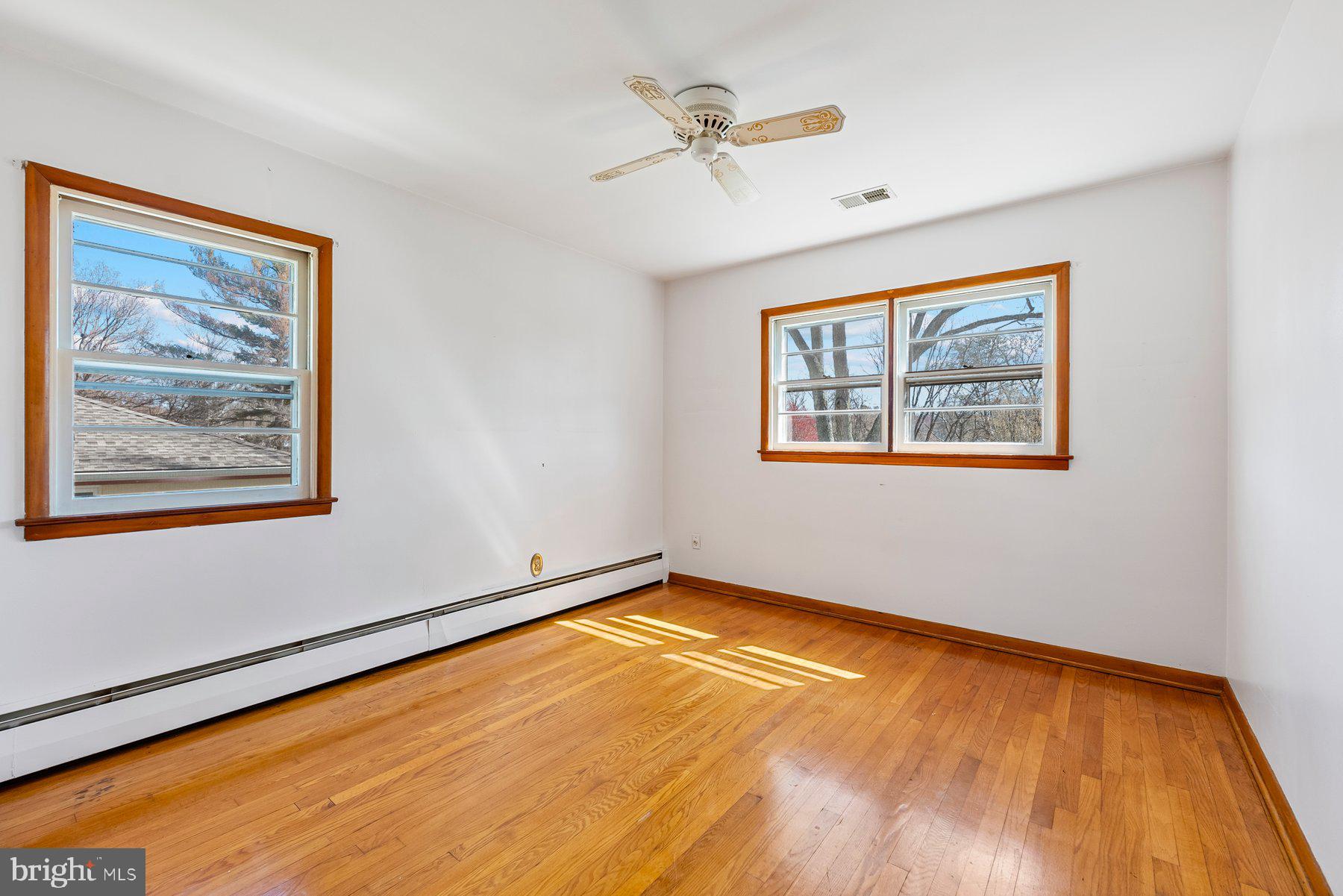 104 Hillside Road Baltimore, MD 21228 - Photo 25 of 34 a view of room with window and wooden floor