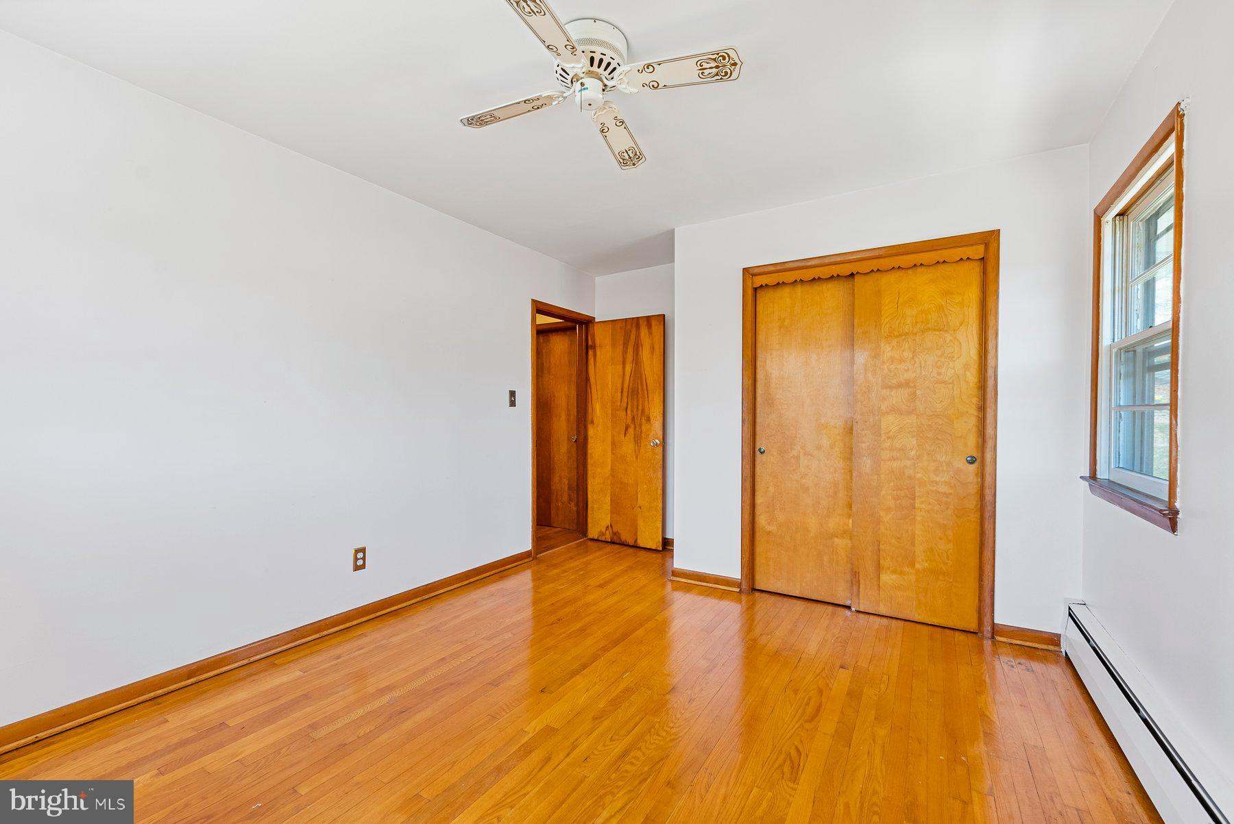 104 Hillside Road Baltimore, MD 21228 - Photo 26 of 34 a view of empty room with wooden floor and fan