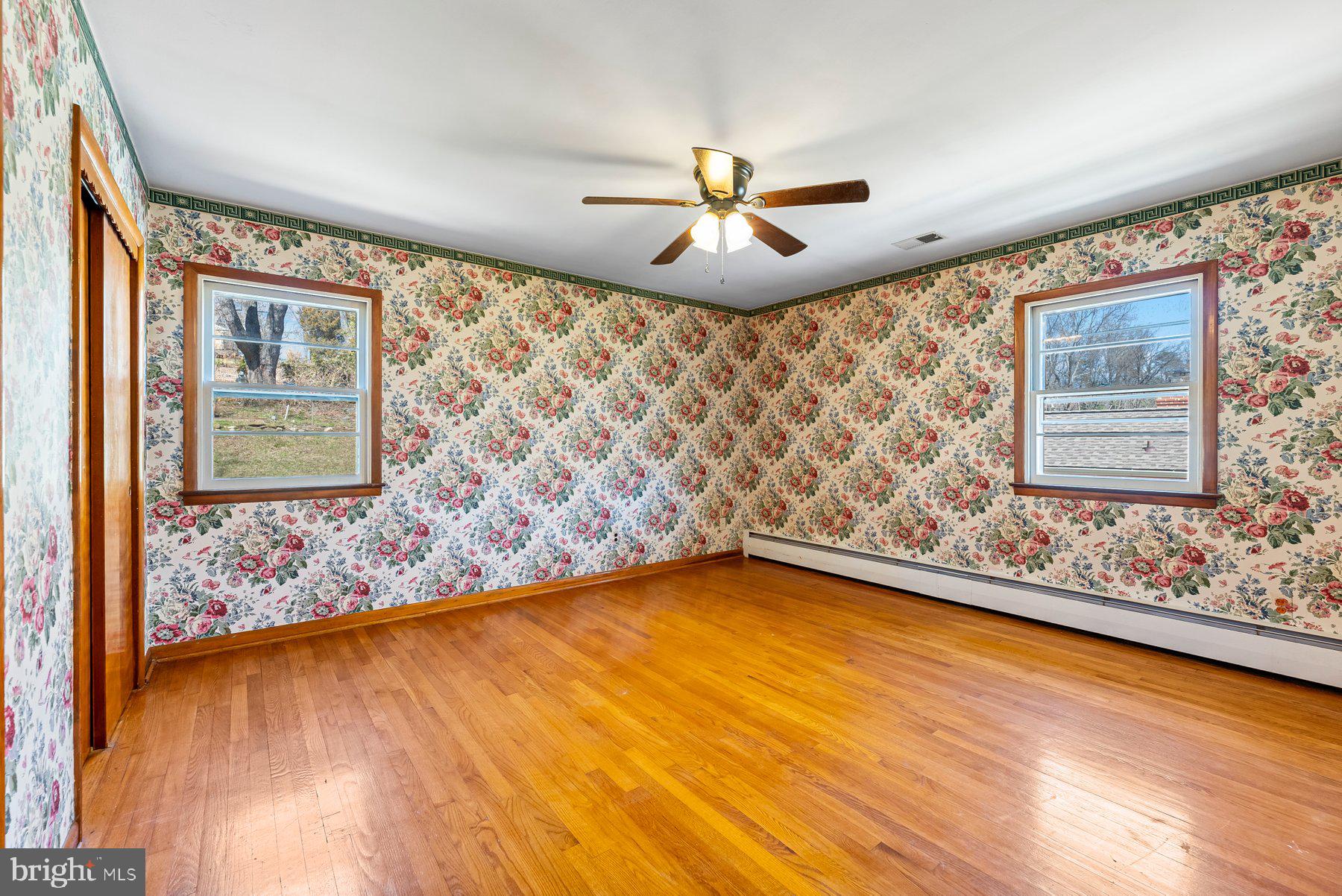 104 Hillside Road Baltimore, MD 21228 - Photo 27 of 34 a view of a room with window and wooden floor