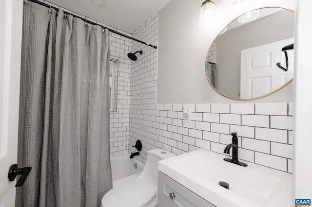 a bathroom with a sink and mirror
