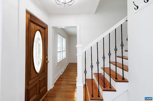 a view of entryway with wooden floor