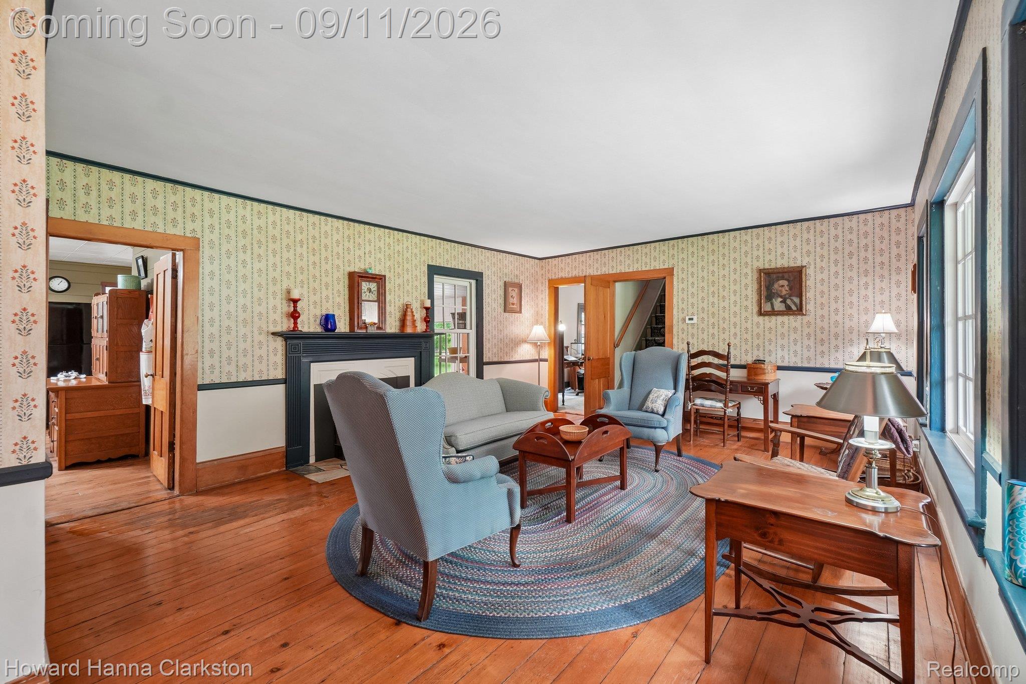 Hardwood flooring, cozy wood burning fireplace with mantel.
