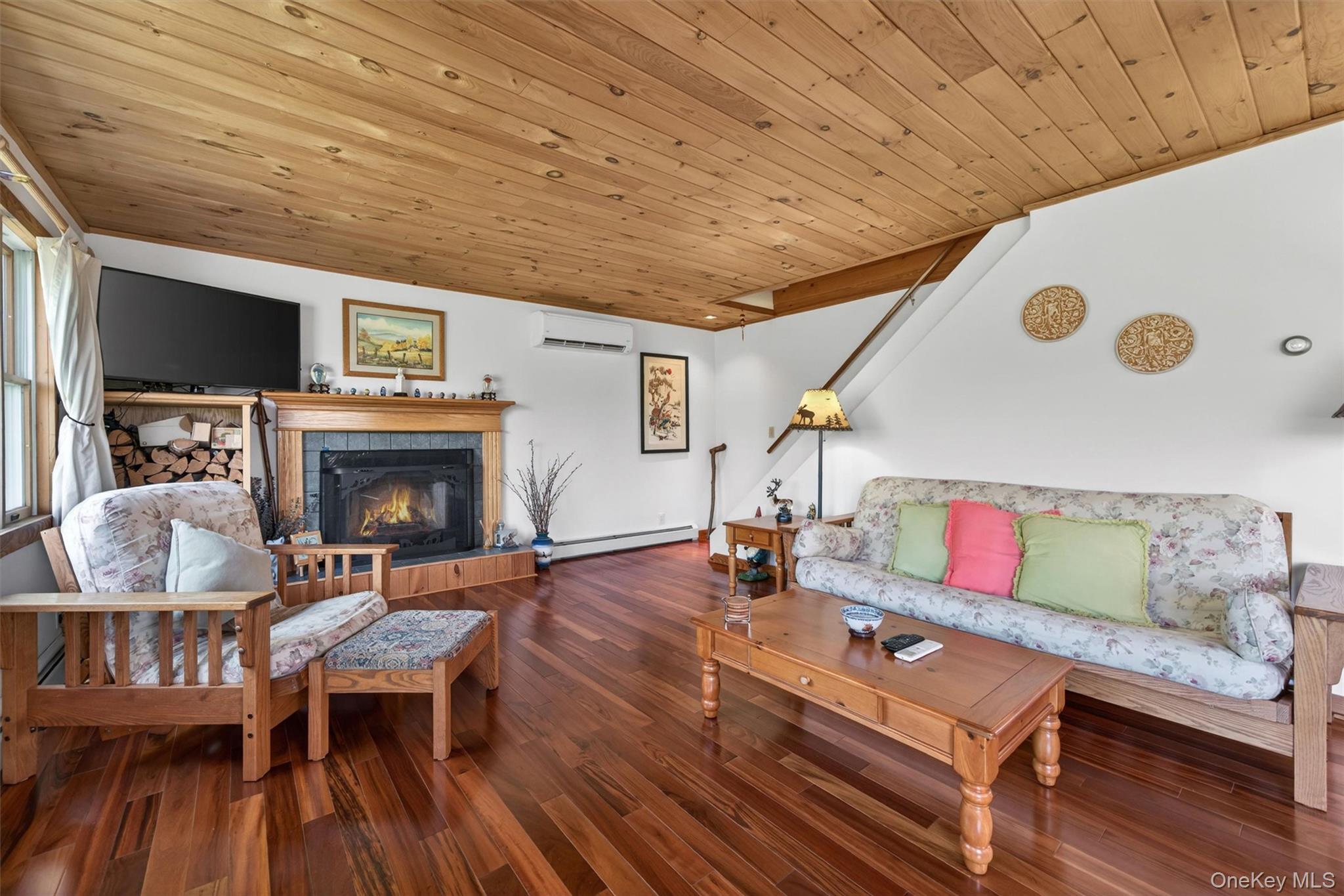 340 Hospital Road Callicoon, NY 12723 - Photo 15 of 41 a living room with furniture and a fireplace