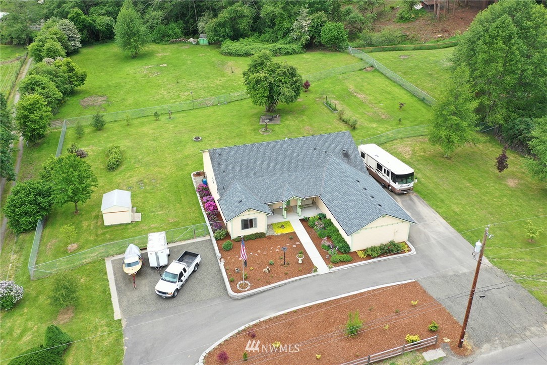 an aerial view of a house with outdoor space