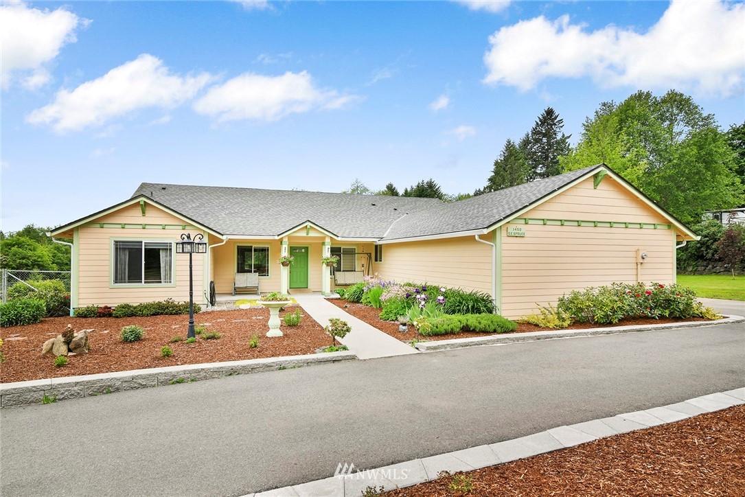 1450 Southeast Spruce Road Port Orchard, WA 98367 - Photo 2 of 40 a front view of house with yard