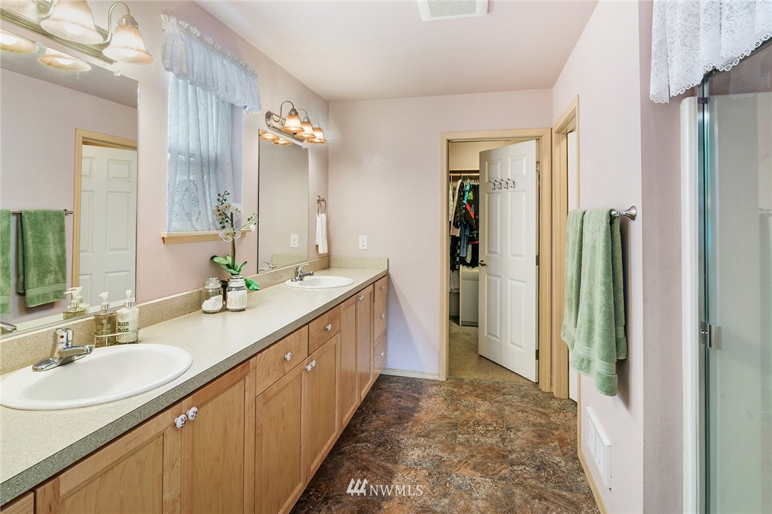 1450 Southeast Spruce Road Port Orchard, WA 98367 - Photo 13 of 40 a bathroom with a sink double vanity granite tub and shower