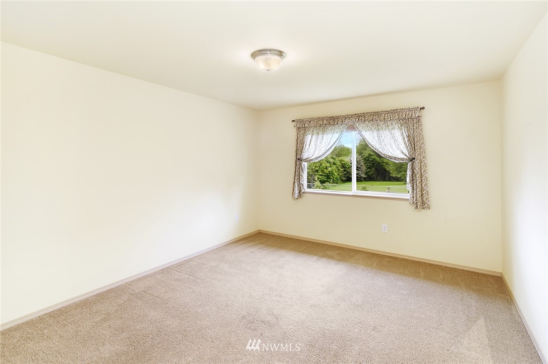 1450 Southeast Spruce Road Port Orchard, WA 98367 - Photo 14 of 40 an empty room with windows