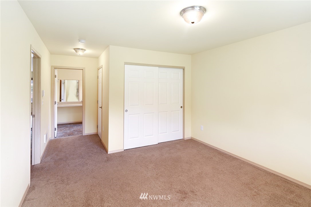 1450 Southeast Spruce Road Port Orchard, WA 98367 - Photo 15 of 40 a view of a hallway with wooden shelves