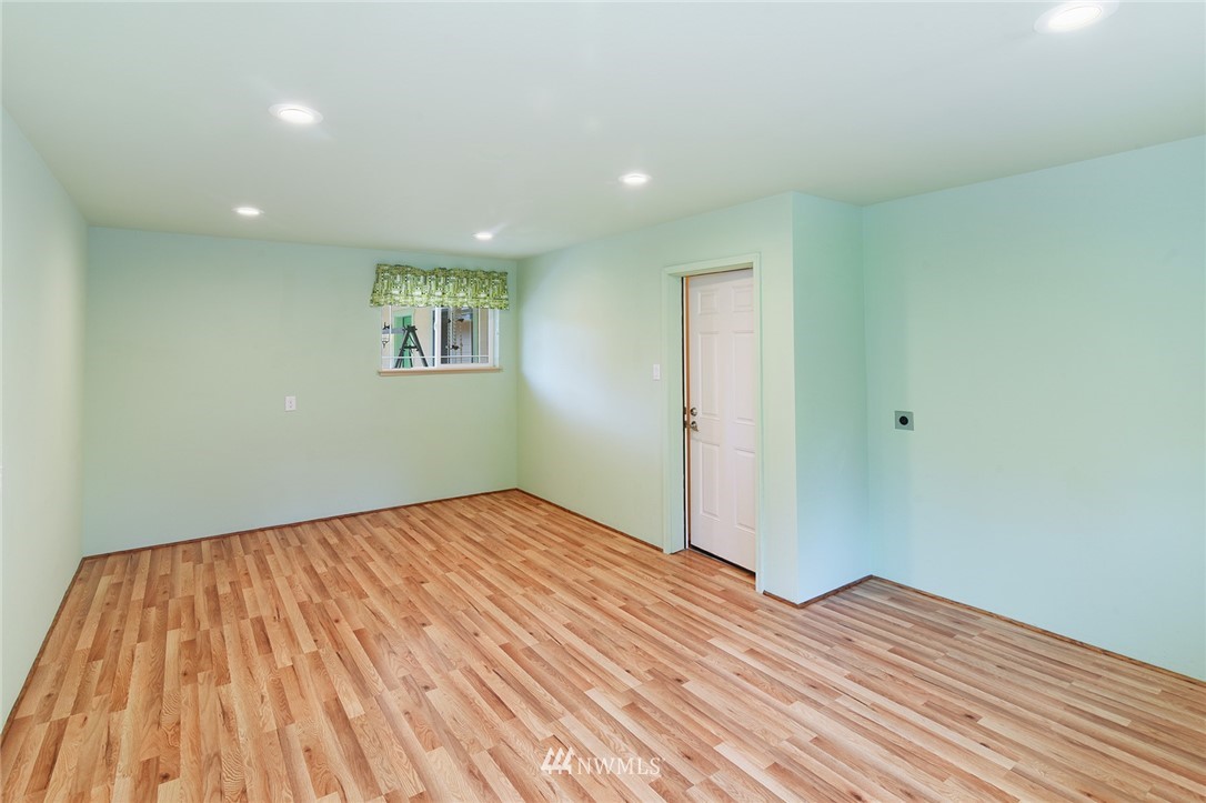 1450 Southeast Spruce Road Port Orchard, WA 98367 - Photo 20 of 40 a view of a room with wooden floor and bathroom