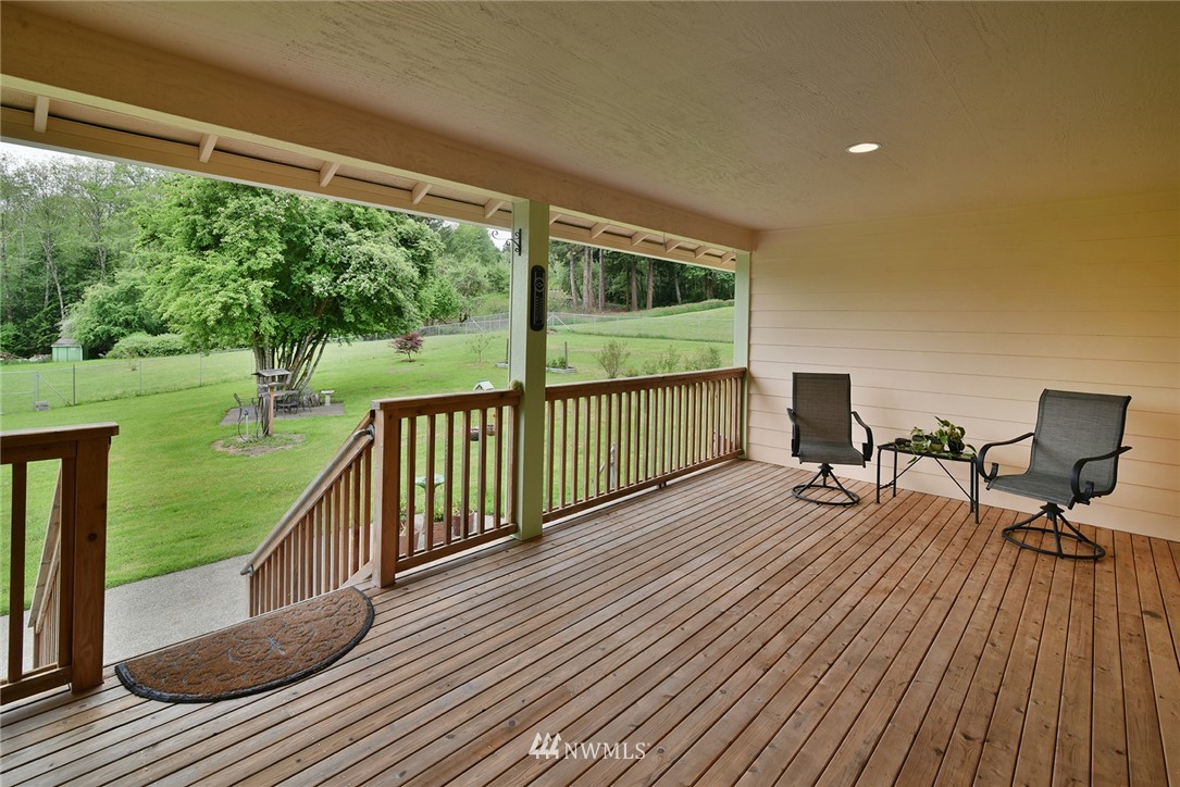 1450 Southeast Spruce Road Port Orchard, WA 98367 - Photo 23 of 40 a view of balcony with deck and outdoor seating