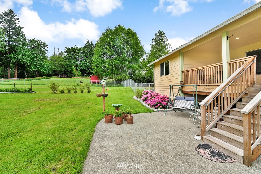 1450 Southeast Spruce Road Port Orchard, WA 98367 - Photo 25 of 40 a view of a backyard with a garden and plants