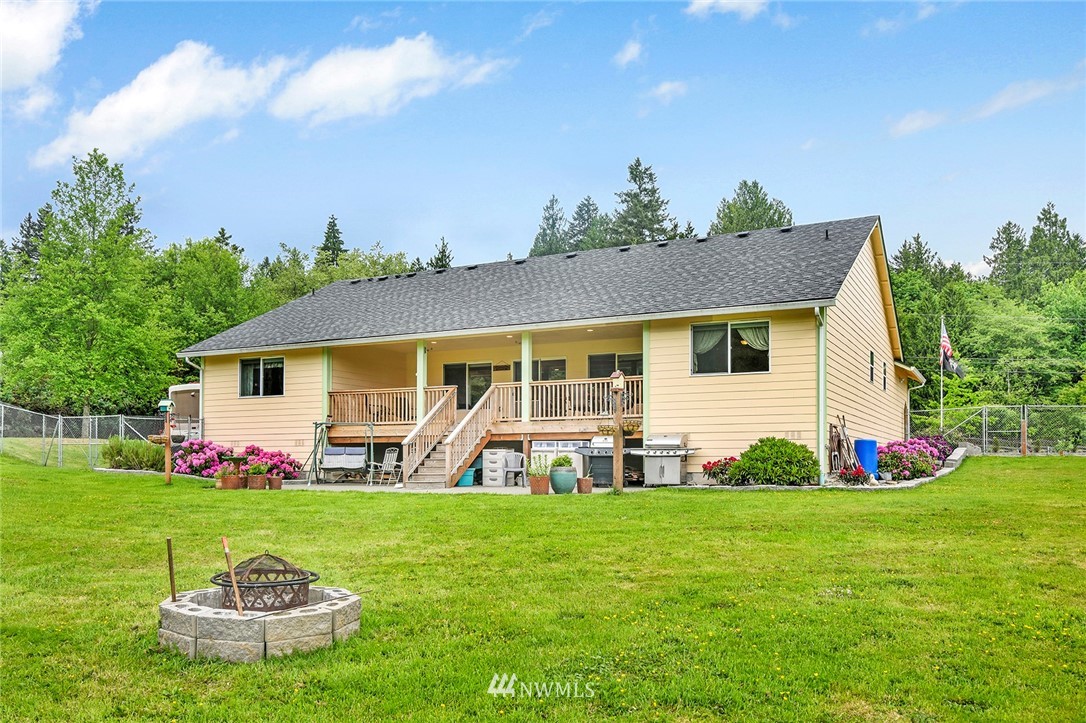 1450 Southeast Spruce Road Port Orchard, WA 98367 - Photo 27 of 40 a front view of a house with garden