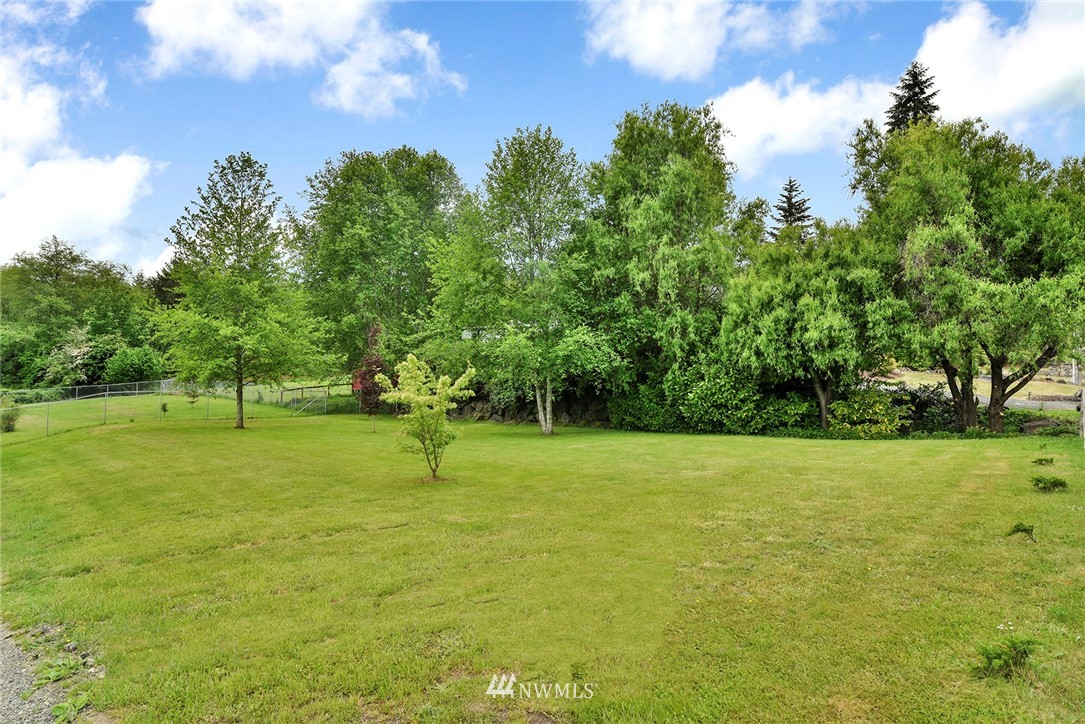 1450 Southeast Spruce Road Port Orchard, WA 98367 - Photo 29 of 40 a view of field with trees in the background