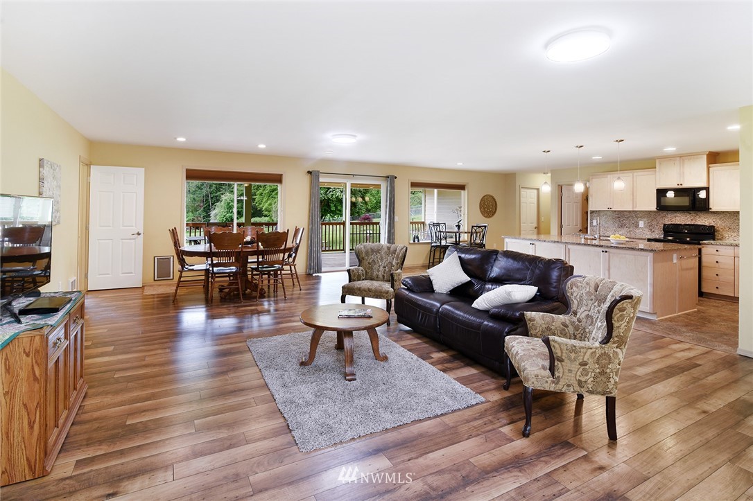 1450 Southeast Spruce Road Port Orchard, WA 98367 - Photo 4 of 40 a living room with furniture and a wooden floor