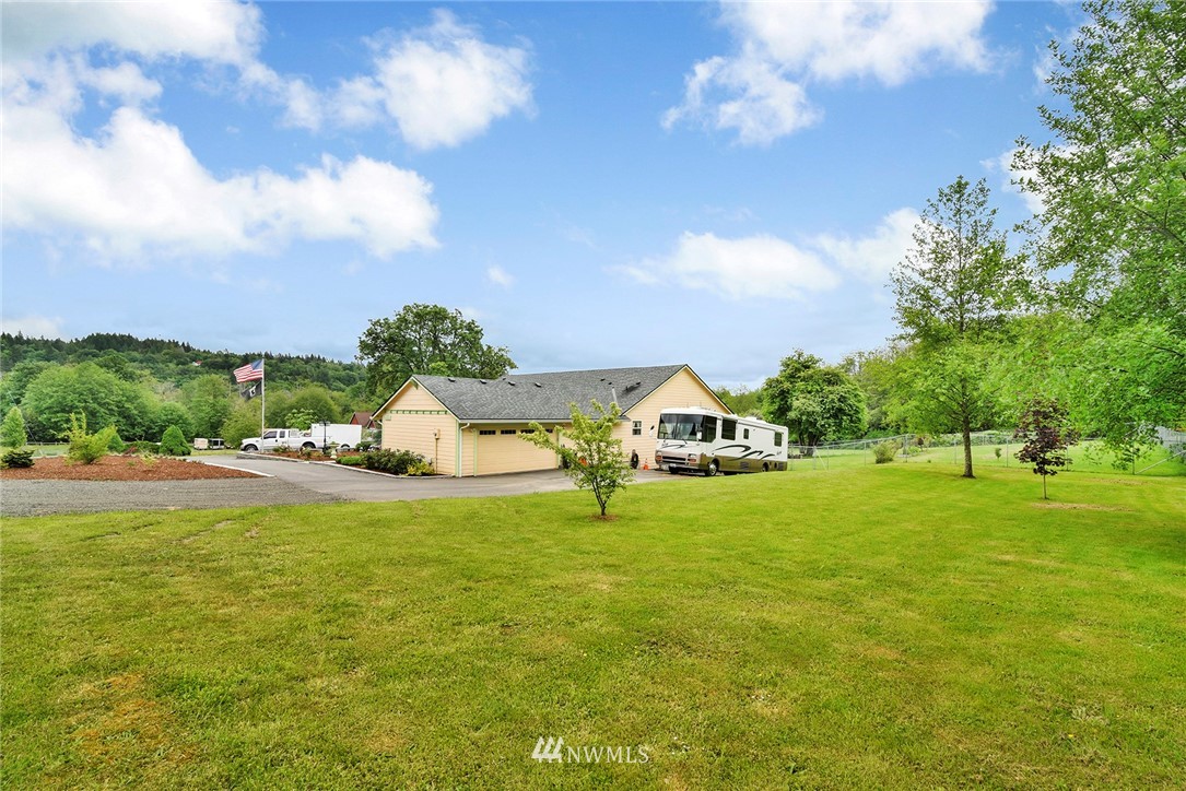 1450 Southeast Spruce Road Port Orchard, WA 98367 - Photo 34 of 40 a house view with a garden space