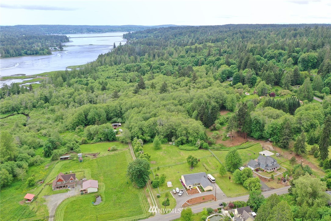 1450 Southeast Spruce Road Port Orchard, WA 98367 - Photo 35 of 40 a view of a lake with a yard