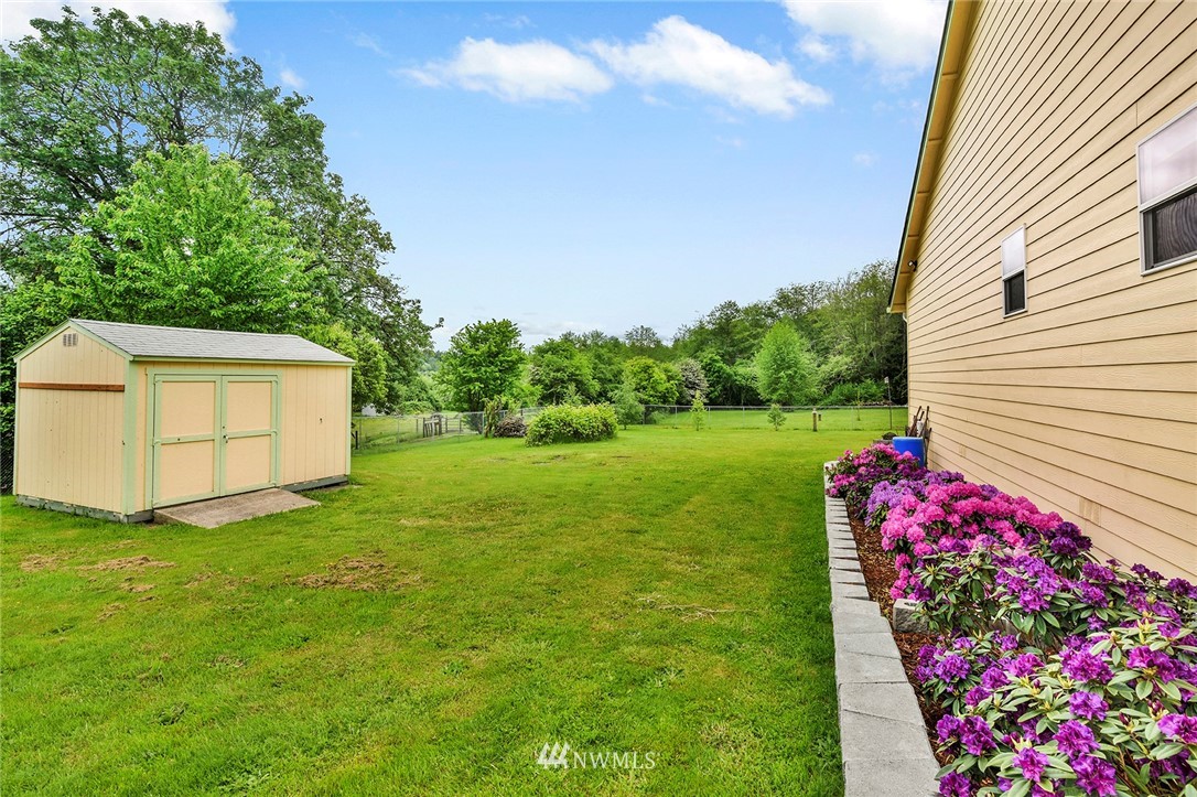 1450 Southeast Spruce Road Port Orchard, WA 98367 - Photo 36 of 40 a view of a house with a backyard