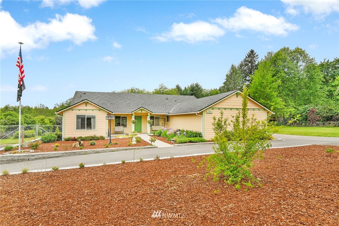 1450 Southeast Spruce Road Port Orchard, WA 98367 - Photo 39 of 40 a front view of a house with a yard and lake view