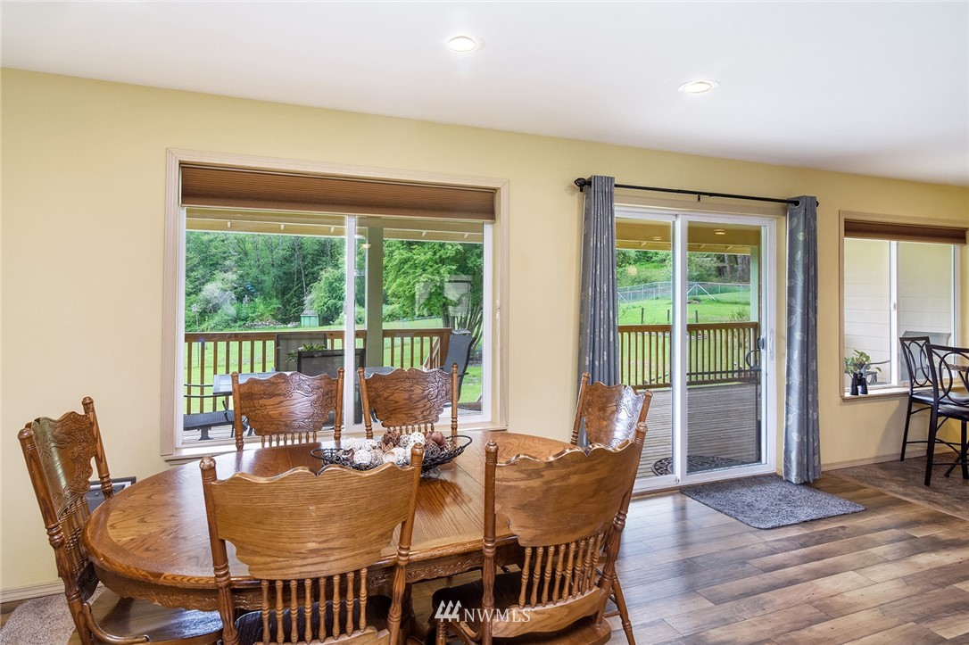 1450 Southeast Spruce Road Port Orchard, WA 98367 - Photo 10 of 40 a view of a dining room with furniture window and outside view