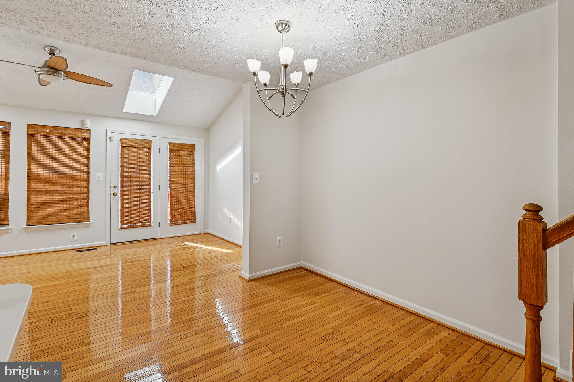 2670 Rainy Spring Court Odenton, MD 21113 - Photo 17 of 79 a view of an empty room with wooden floor and a window