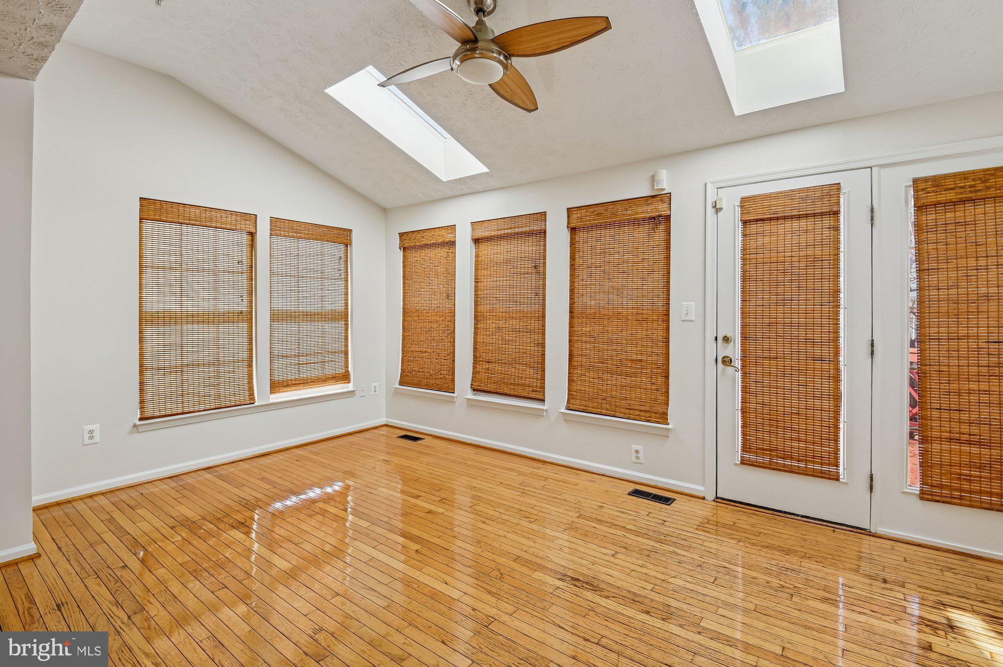 2670 Rainy Spring Court Odenton, MD 21113 - Photo 19 of 79 a view of an empty room with a window and wooden floor