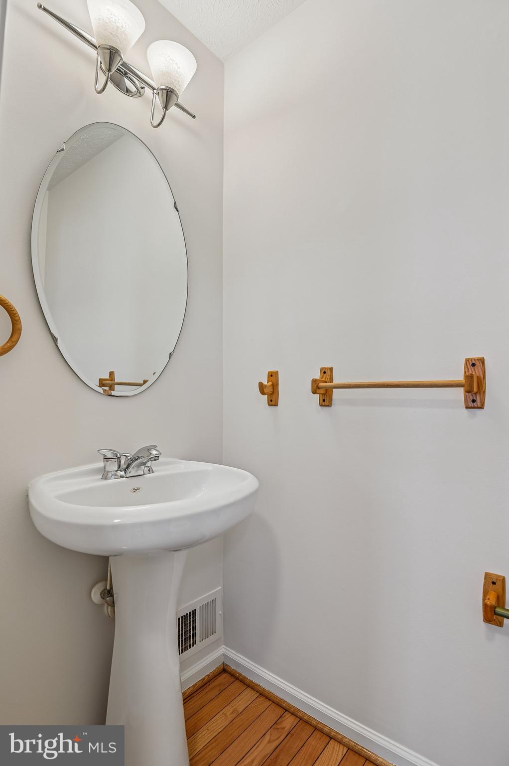 2670 Rainy Spring Court Odenton, MD 21113 - Photo 21 of 79 a bathroom with a sink a mirror and vanity