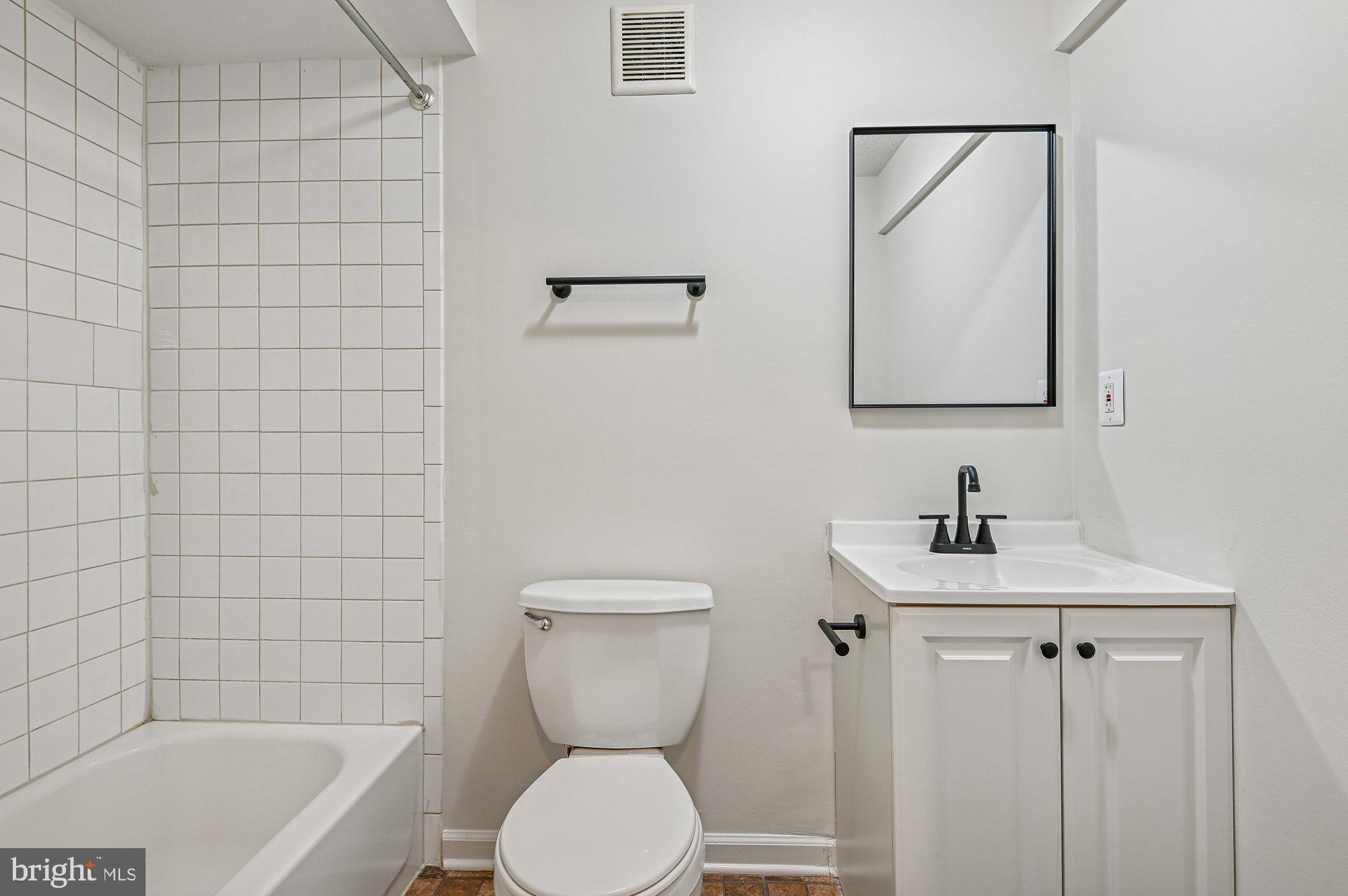 2670 Rainy Spring Court Odenton, MD 21113 - Photo 31 of 79 a bathroom with a toilet a sink a mirror and bathtub