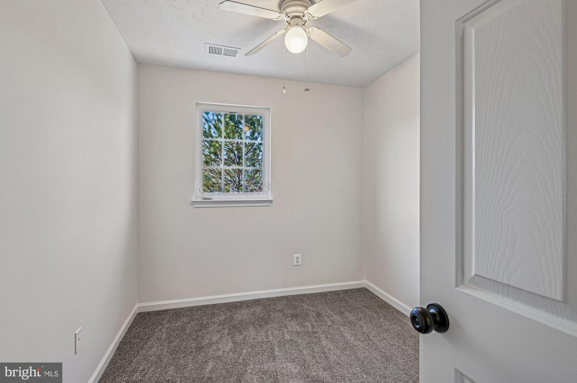 2670 Rainy Spring Court Odenton, MD 21113 - Photo 32 of 79 an empty room with a window and a fan
