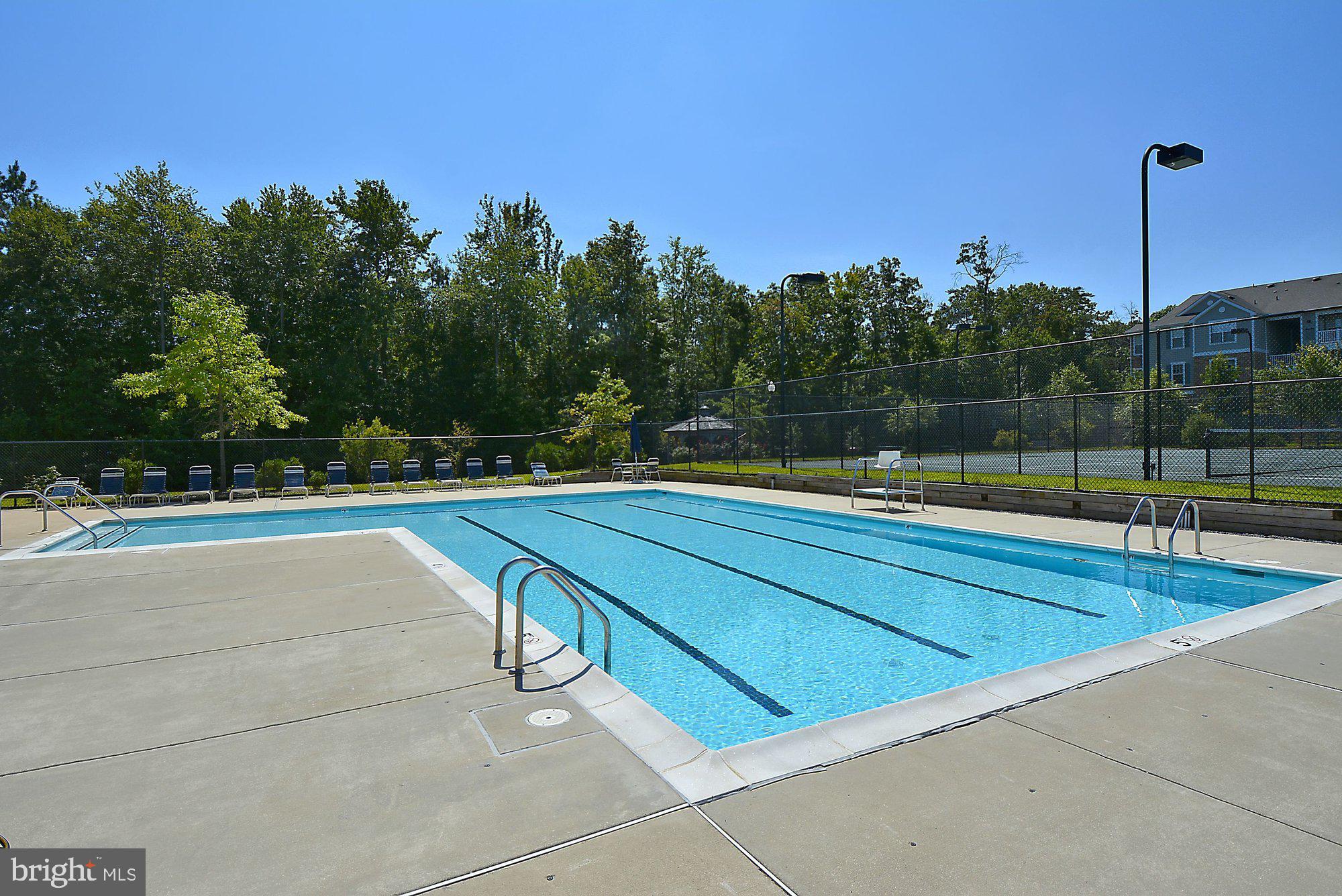 2670 Rainy Spring Court Odenton, MD 21113 - Photo 50 of 79 a view of swimming pool with outdoor seating and yard in back