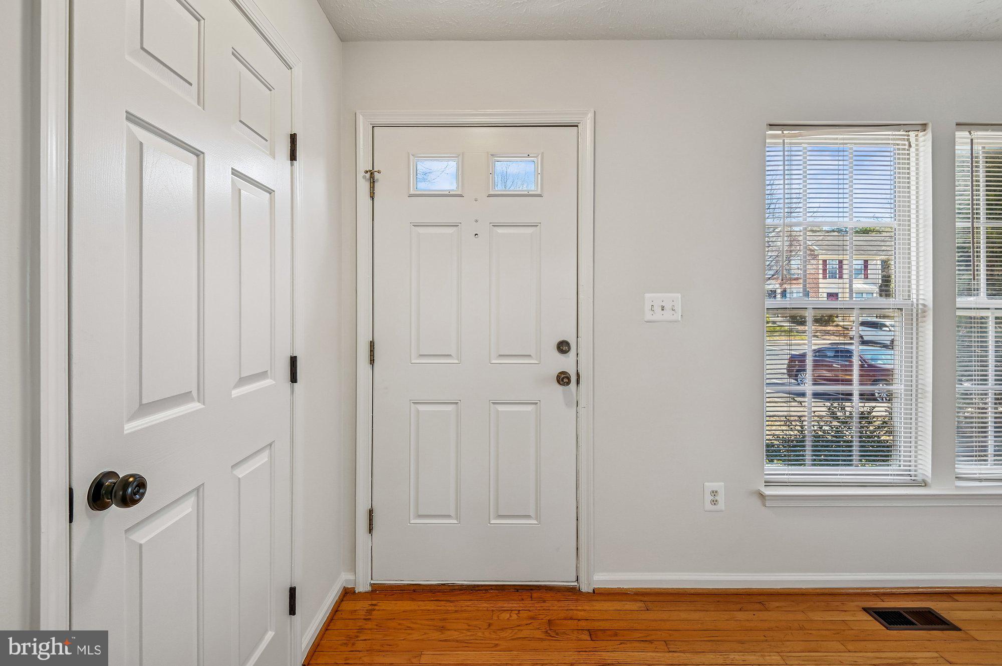 2670 Rainy Spring Court Odenton, MD 21113 - Photo 5 of 79 a view of empty room with window and wooden floor