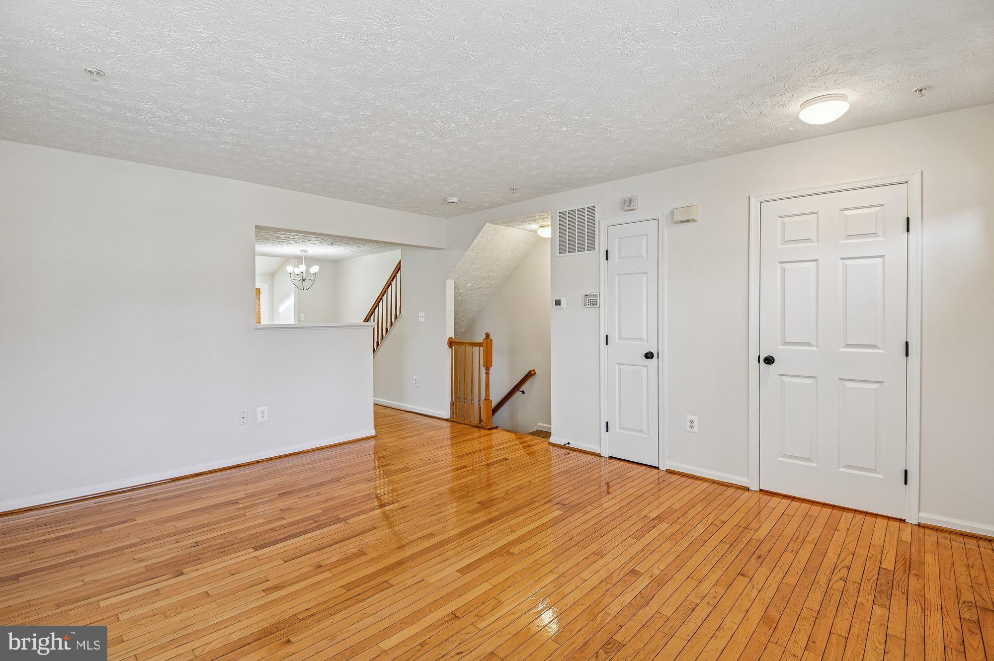 2670 Rainy Spring Court Odenton, MD 21113 - Photo 9 of 79 a view of an empty room with wooden floor