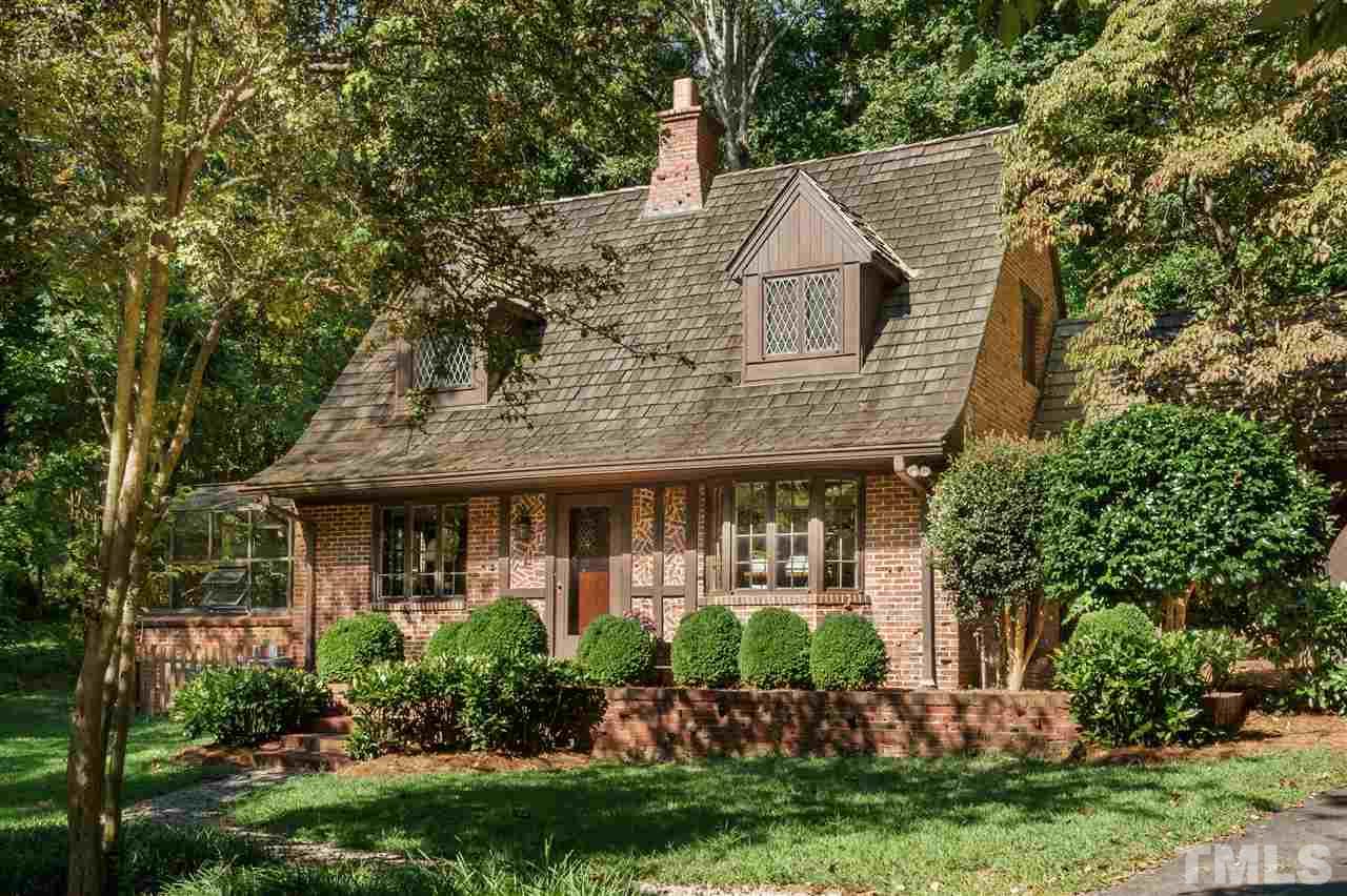 1101 Hymettus Court Raleigh, NC 27607 - Photo 1 of 25 a front view of a house with a garden and plants