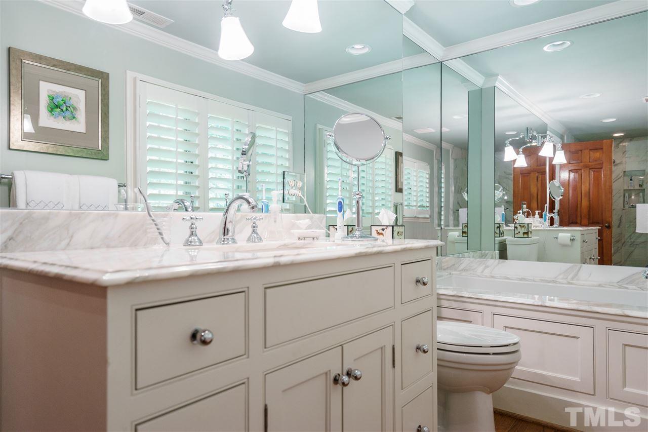 1101 Hymettus Court Raleigh, NC 27607 - Photo 17 of 25 a bathroom with a granite countertop sink mirror and toilet