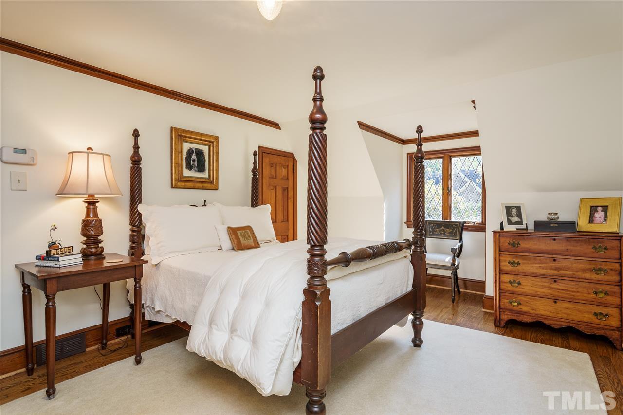 1101 Hymettus Court Raleigh, NC 27607 - Photo 20 of 25 a bedroom with furniture and a window