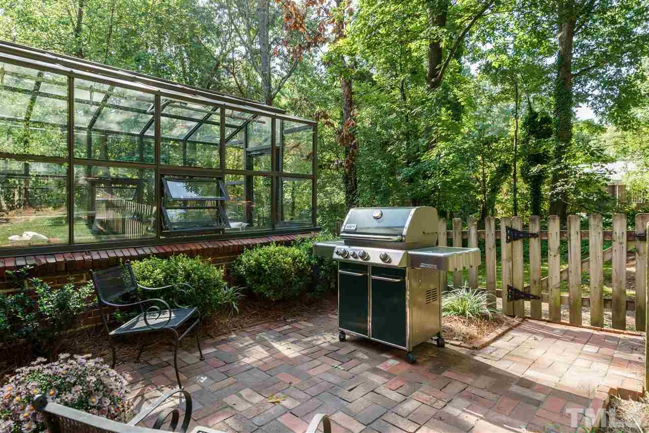 1101 Hymettus Court Raleigh, NC 27607 - Photo 22 of 25 a view of a chairs and table in the back yard of the house