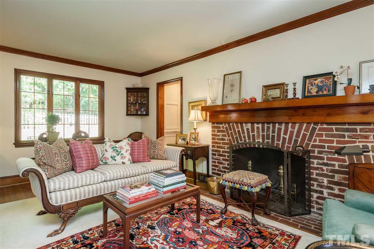 1101 Hymettus Court Raleigh, NC 27607 - Photo 6 of 25 a living room with furniture and a fireplace