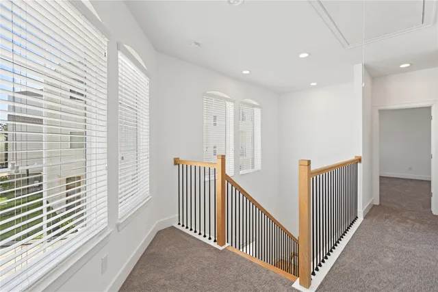 a view of a hallway with windows