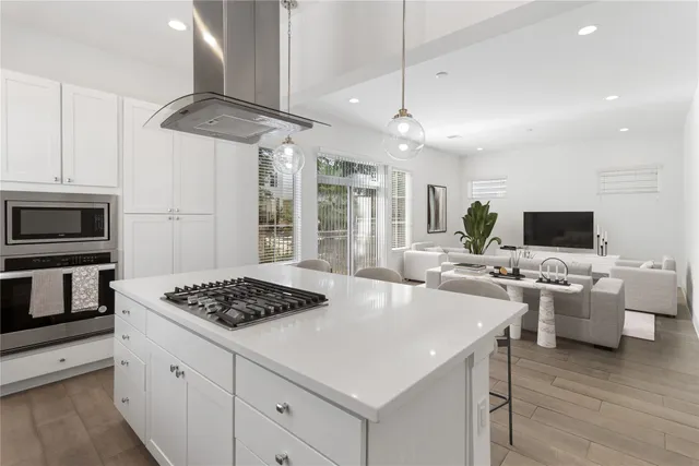 a kitchen with a counter space appliances and cabinets