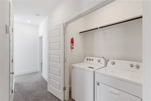a view of storage and utility room with washer and dryer