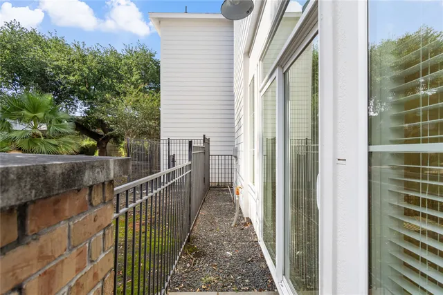 a view of a balcony with wooden floor